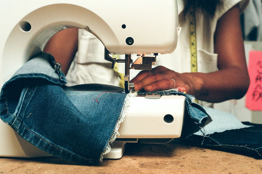 woman using a sewing machine